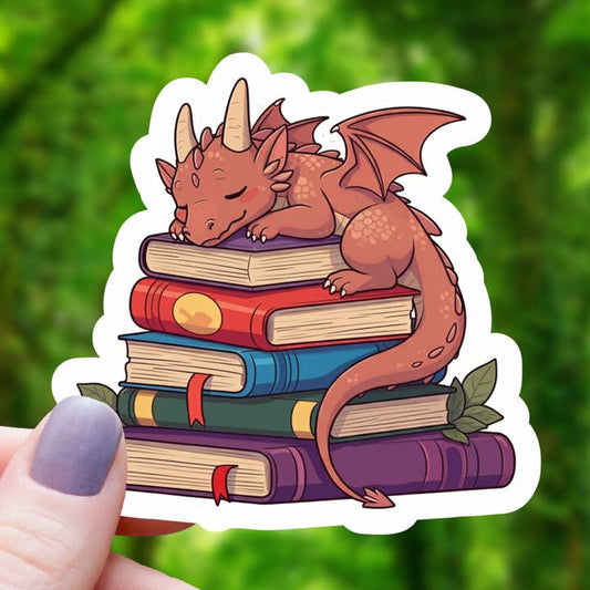 RED DRAGON SLEEPING ON BOOKS STICKER