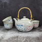 SMILING CAT TEA SET (TEAPOT AND FOUR TEACUPS)
