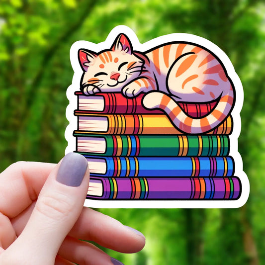 ORANGE CAT ON PILE OF BOOKS STICKER