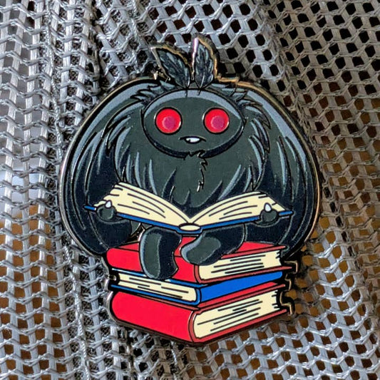 MOTHMAN READING A BOOK ENAMEL PIN